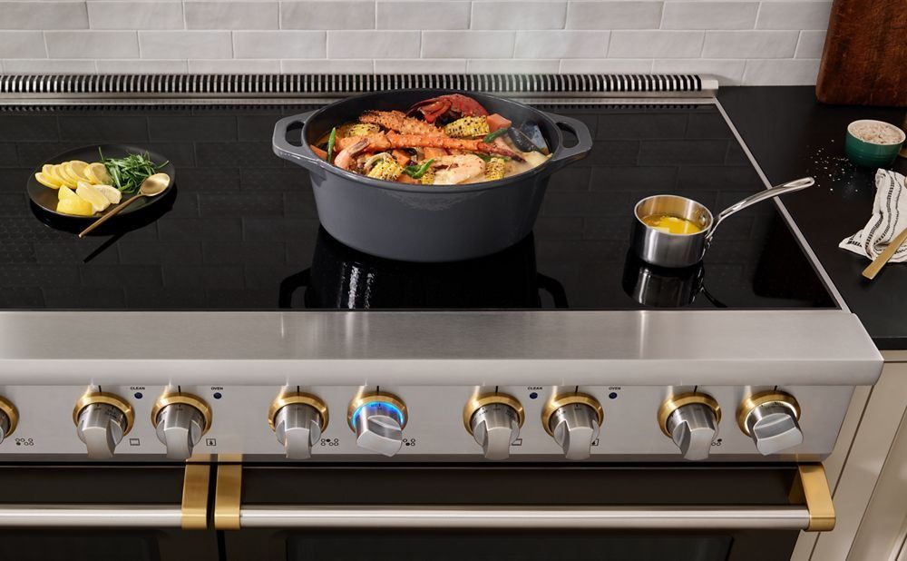 Viking induction Range top with pot of simmering seafood jambalaya